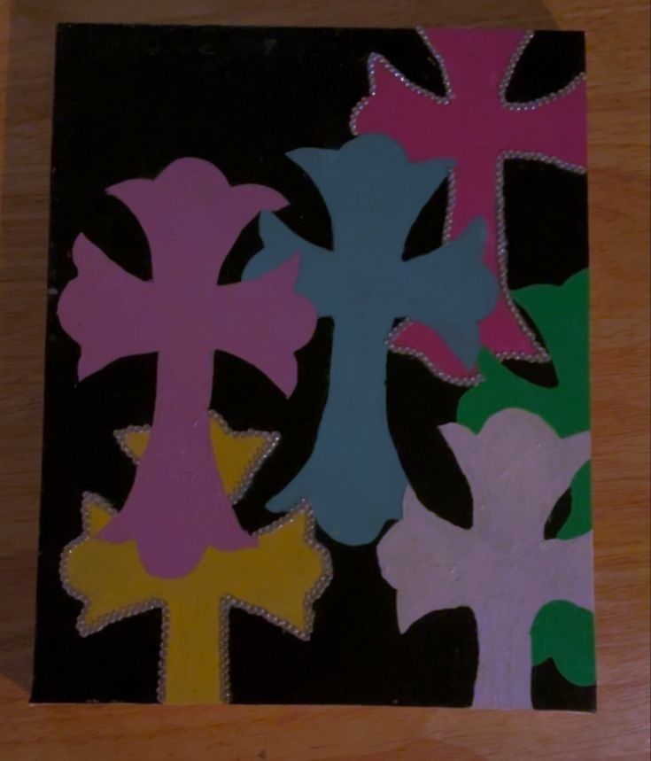 the cross is made out of colored paper