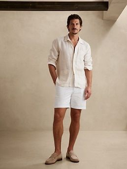 Soft and sophisticated, this resort-ready pair of seersucker shorts employs sumptuous cotton and a pleated front to set a more-tailored tone for any occasion.  SLIM FIT: Mid rise, with a slim leg.  Zip fly with button closure.  Front and back pockets St Tropez Outfit Men, Palm Springs Mens Outfits, French Riviera Outfits Men, Beach Party Men Outfit, Mens Rehearsal Dinner Outfit Summer, Summer Casual Men Outfits, White Party Attire Men, Beach Wedding Outfits For Men Guest, Men’s Dress Attire For Beach Wedding