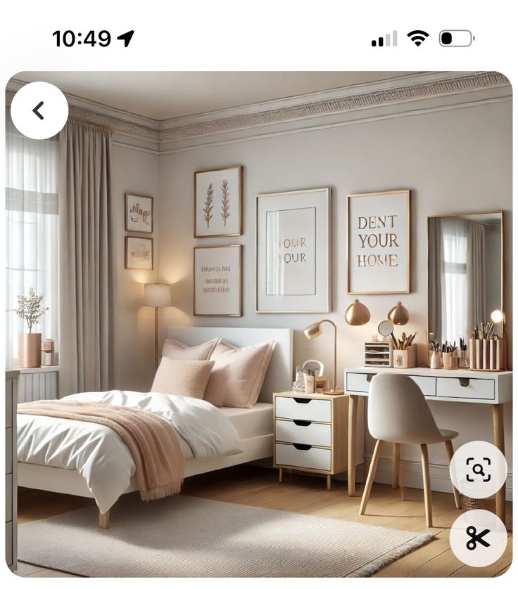 an image of a bedroom setting with pictures on the wall above the bed and desk