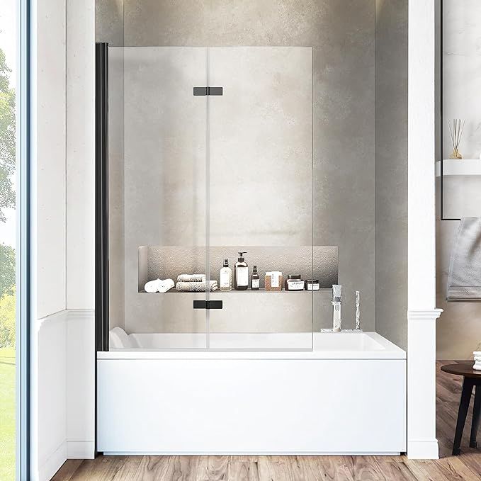 a white bath tub sitting inside of a bathroom next to a wooden table and chair