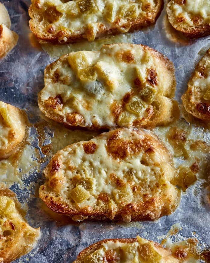 several pieces of bread with cheese on it