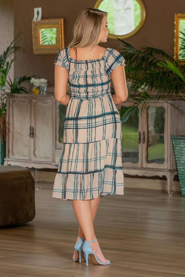 Trend Alert! The Olivia Dress features the hottest trend of the season: Smocked Bodice. This super feminine dress is lightweight and ideal for any spring and summer event! Color: Blue/Cream *Fit varies by brand. Always check Sizing Tab for reference. Details -A-line silhouette -Smocked bodice -Short sleeves Material and Care -100% Polyester -Lining 100% Polyester -Hand wash -Imported Casual Dress With Smocked Bodice And Square Neck, Casual Square Neck Dress With Smocked Bodice, Casual Midi Sundress With Smocked Back, Casual Midi Sundress For Brunch, Casual Smocked Square Neck Dress For Day Out, Casual Smocked Dress With Square Neck For Day Out, Casual Square Neck Smocked Dress For Day Out, Casual Square Neck Midi Dress For Garden Party, Casual Maxi Dress With Smocked Bodice