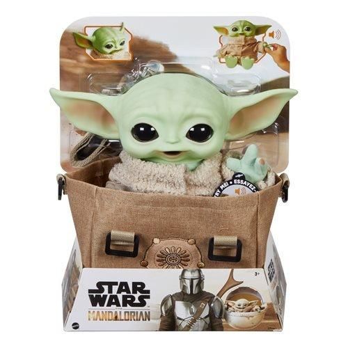 the child yoda doll is in a bag