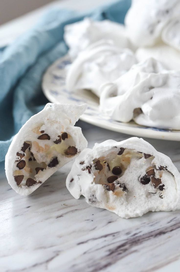 two plates filled with whipped cream and chocolate chips