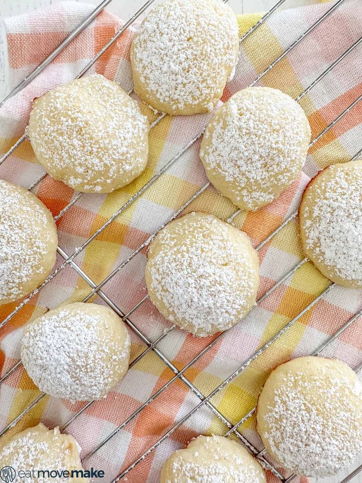 powdered sugar cookies cooling on a wire rack