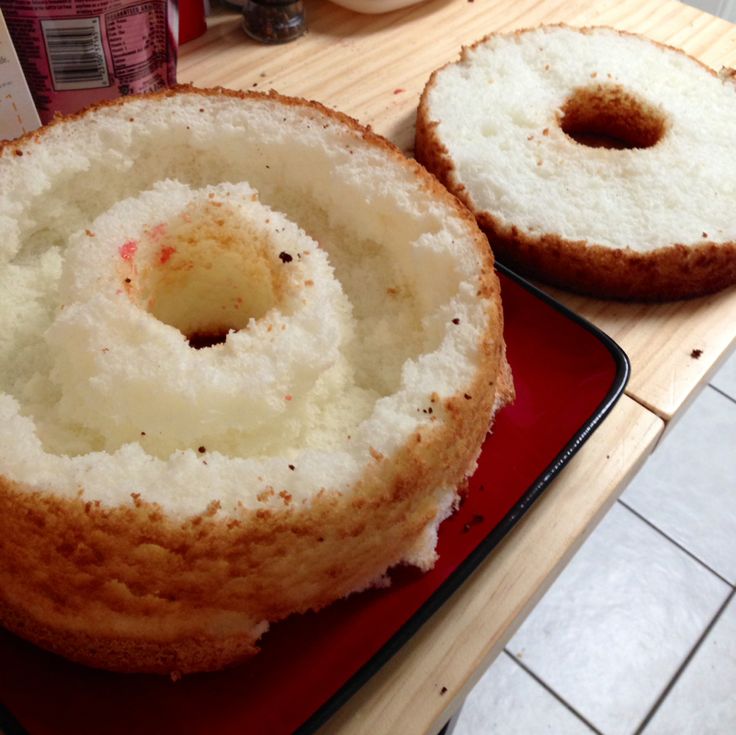 two donuts sitting on top of a red plate