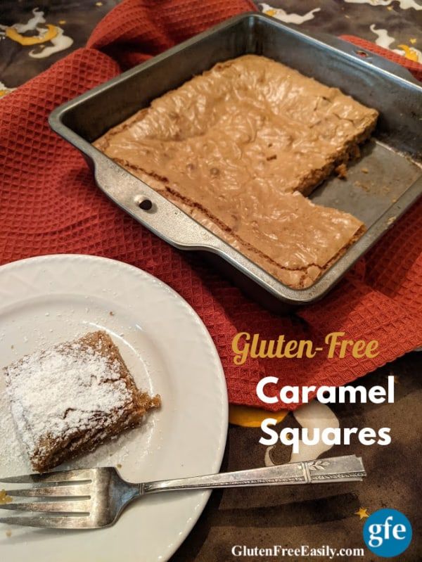 a plate with a piece of cake on it next to a pan filled with caramel squares