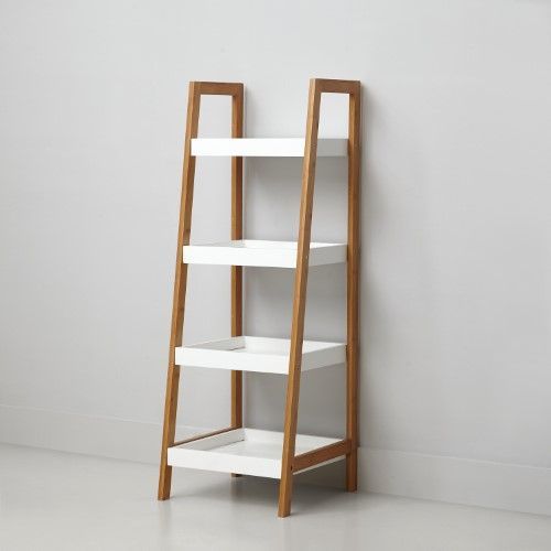 a white shelf with three shelves on each side and a wooden ladder leaning against the wall