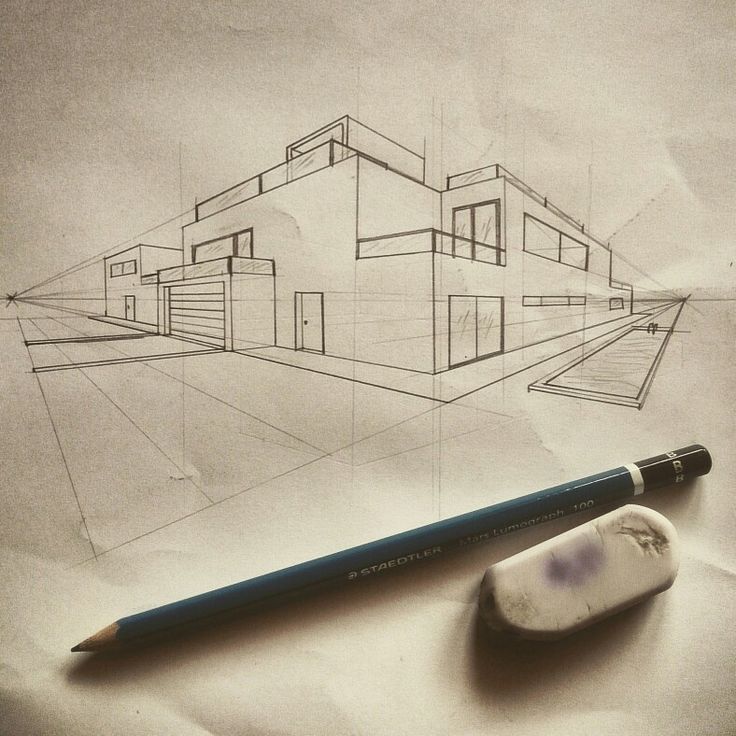 a pencil is next to a drawing of a house