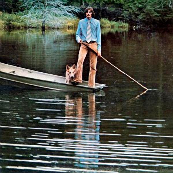 an autographed photo of a man and his dog on a boat in the water