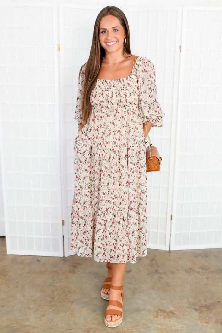 Step up your style game with the Meadow Muse Floral Midi Dress , a cute and feminine floral maxi dress that is sure to make a statement. Its full sleeves, ruched bodice, and pockets add both flair and functionality. For a more customized look, you can switch the waist tie from front to back, allowing you to play up your personal style. This flirty dress is perfect for any fall occasion, whether it's a cozy dinner party or a glamorous wedding. With its full, quarter-inch puff sleeves, smocked bod Spring Square Neck Midi Dress With Ditsy Floral Print, Spring Square Neck Ditsy Floral Midi Dress, Flowy Square Neck Maxi Dress For Garden Party, Flowy Floral Print Midi Dress With Square Neck, Chic Flowy Maxi Dress With Ditsy Floral Print, Square Neck Ditsy Floral Maxi Dress For Garden Party, Chic Ditsy Floral Maxi Dress For Day Out, Chic Ditsy Floral Print Maxi Dress For Garden Party, Maxi Floral Dress With Ditsy Print For Garden Party