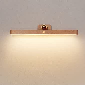 a light that is on the side of a wall with a white lamp above it