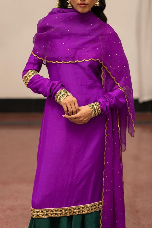 Violet woven kurta with floral embroidery on the border. Paired with sharara and dupatta.
Components: 3
Pattern: Embroidered, Woven
Type Of Work: Floral
Neckline: Round
Sleeve Type: Full
Fabric: Kurta, Sharara: Munga Silk, Dupatta: Organza Silk
Color: Purple, Green
Other Details: 
Model height: 5ft 7inches, wearing size S
Length: 48 inches
Occasion: Puja - Aza Fashions Anarkali Tussar Silk Sharara With Gota Work, Traditional Cotton Silk Lehenga With Dabka Work, Festive Tussar Silk Anarkali Set With Dabka Work, Traditional Lehenga With Dabka Work In Cotton Silk, Bollywood Tussar Silk Sets With Gota Work, Tussar Silk Sharara For Wedding And Navratri, Purple Raw Silk Kurta With Resham Embroidery, Anarkali Tussar Silk Sharara With Dabka Work, Festive Tussar Silk Sharara With Gota Work