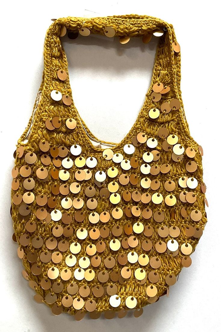 Sequin Handbags  are   hand-made, high quality, original designs, and beautiful. They are unique for evenings and special events and their designs are inspired by contemporary fashion and vintage looks. Sequin handbags are a perfect balance of aesthetics and functionality. Size: 12"x10" Large Cheap Vintage Beaded Shoulder Bag, Bohemian Gold Bags For Festivals, Gold Bohemian Bags For Festivals, Handmade Rectangular Trendy Evening Bag, Bohemian Gold Evening Bag For Festivals, Gold Bohemian Evening Bag For Festivals, Trendy Handheld Evening Bag, Handmade, Vintage Hobo Tote Bag For Evening, Trendy Handmade Shoulder Bag For Party