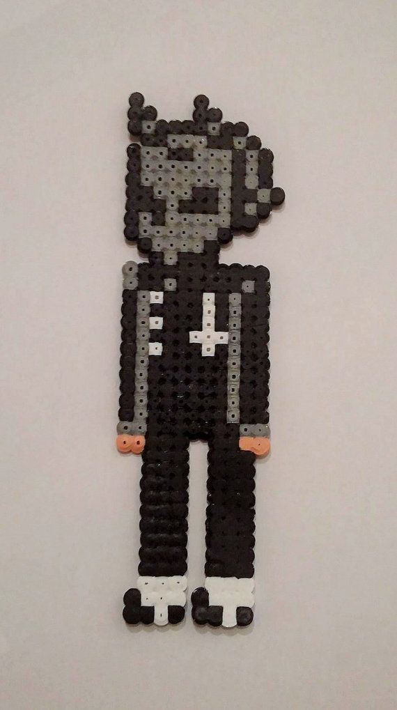 a black and white pixel art piece on a table