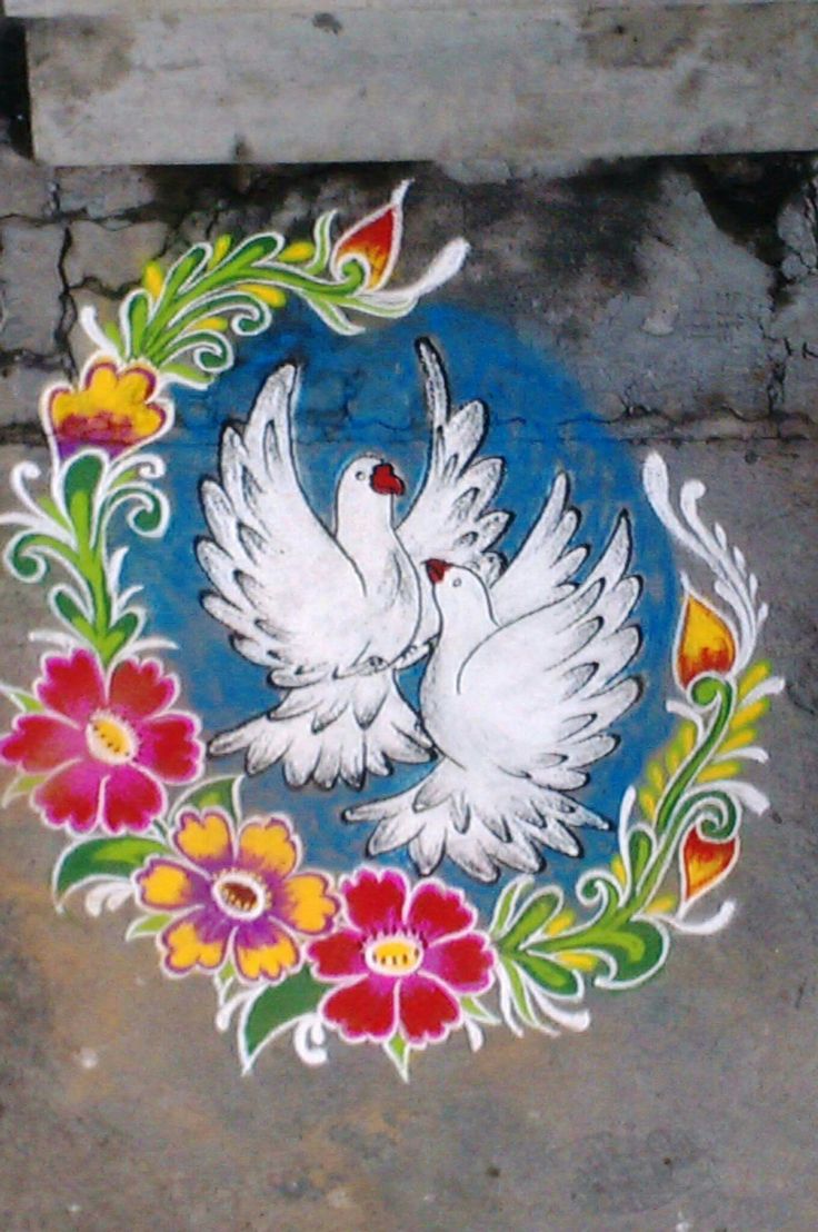 two white doves with flowers painted on the ground