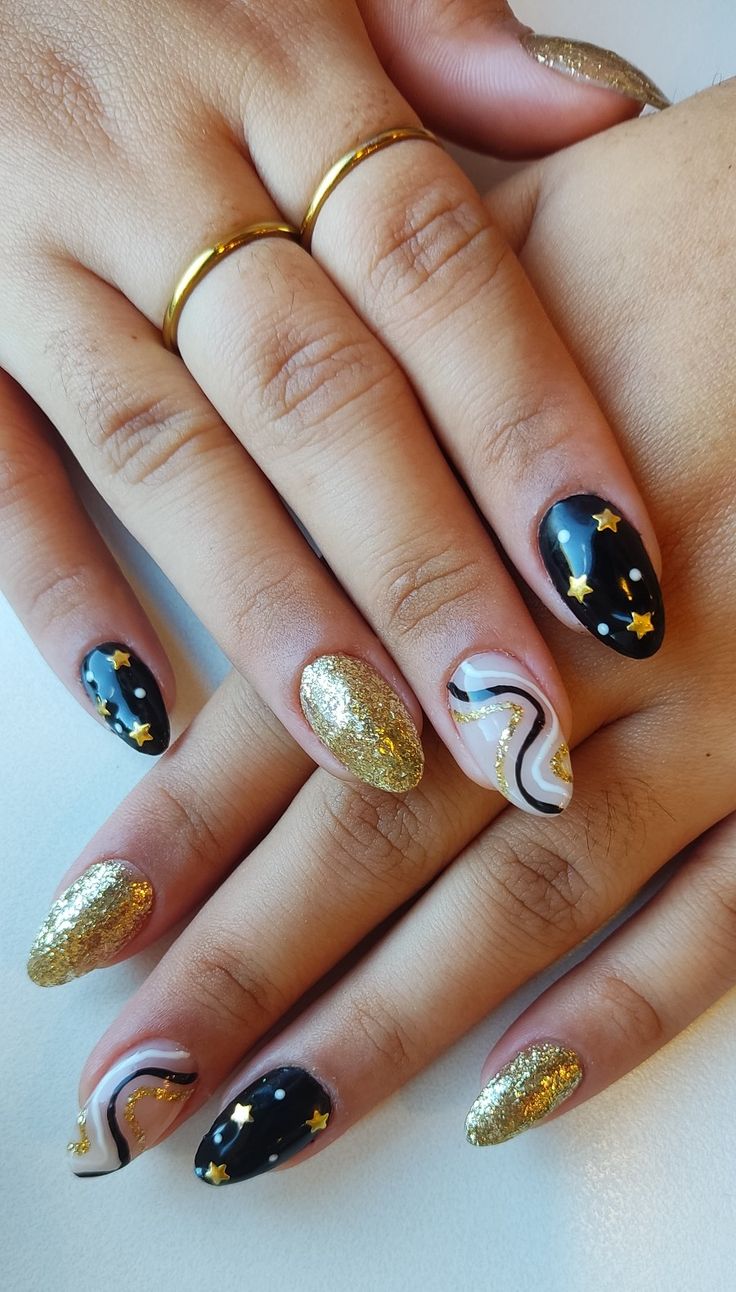 #2022 #2023 #nails #nailart #newyear #newyearnails #gold #black #white #star #holiday #holidaynails Gold Firework Nails, January Nail Art Ideas, Newyears Nails 2021, Gold White And Black Nails, Black And Gold Abstract Nails, Black And Gold Star Nails, Starcatcher Nails, Graduation Nails Black And Gold, Black Gold White Nails