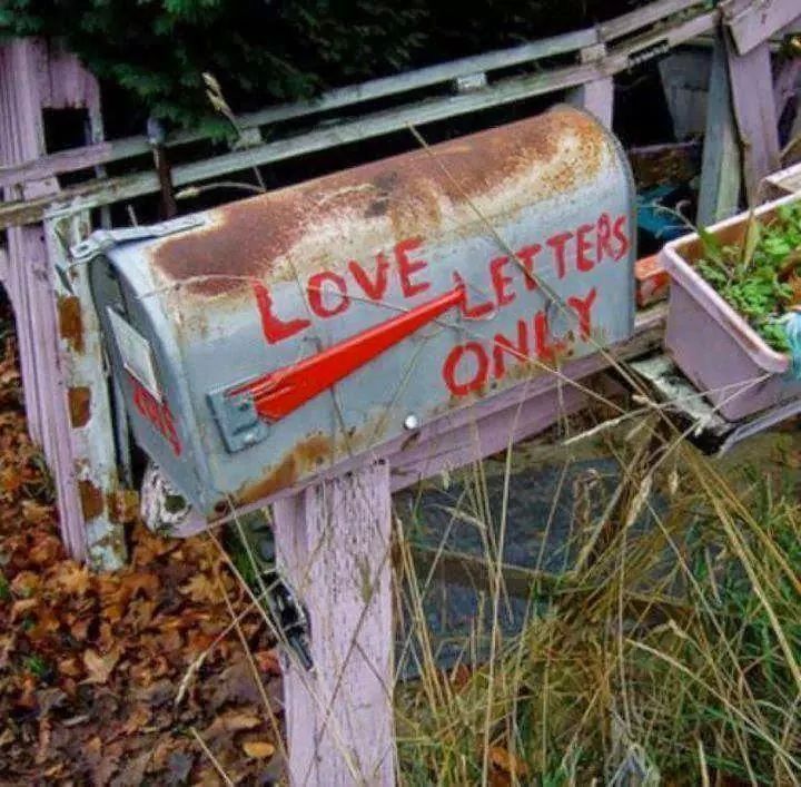 an old mailbox with the word love letters only written on it in red ink