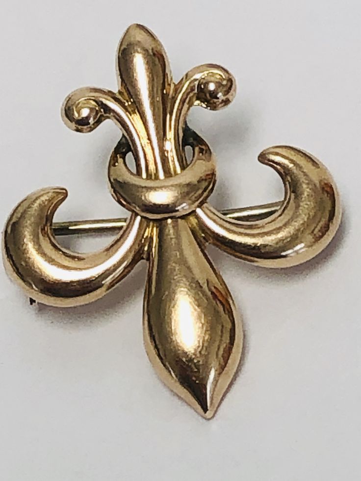 A classic image of the Victorian era ,this beautiful pin/ brooch is a Fleur De Lis in 14k Gold can be worn as a pendant by threading a chain or ribbon through by the small loop at the topor it can be worn as a classic brooch. Condition: Pre-Owned.--Good vintage condition.. Elegant 14k Gold Jewelry With Screw Back, Heirloom Style Collectible Jewelry With Brooch, Timeless Yellow Gold Jewelry With Screw Back, Elegant Yellow Gold Jewelry With Screw Back, Antique Gold Brooch For Formal Occasions, Heirloom Yellow Gold Brooches For Formal Events, Heirloom Gold Jewelry With Screw Back, Classic Yellow Gold Brooch For Anniversary, Antique Brooches For Formal Occasions