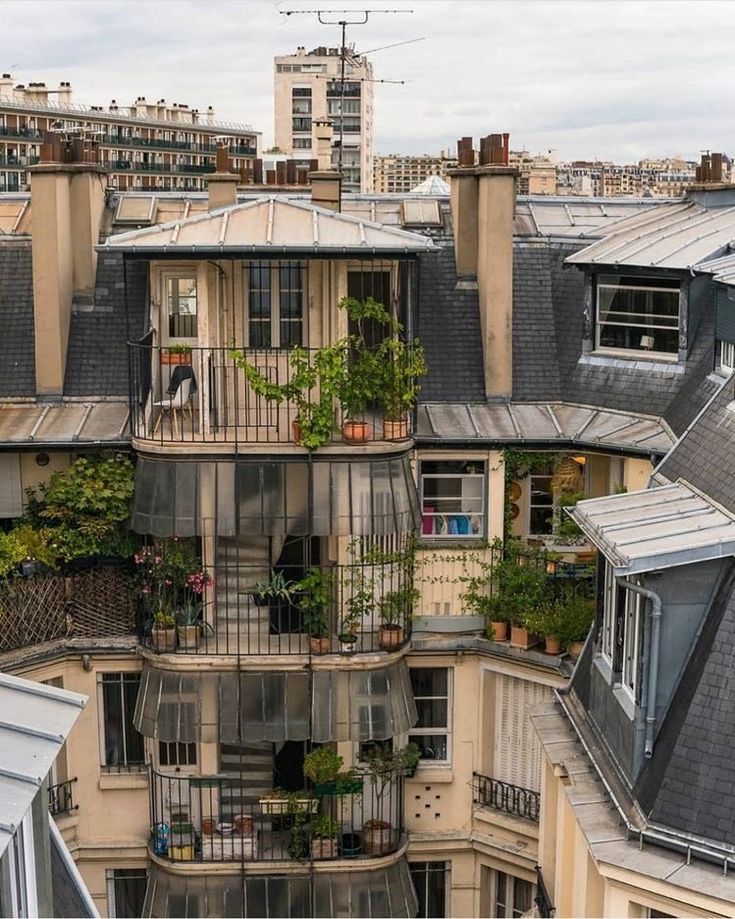 an apartment building with lots of windows and balconies on the top floor is seen from above