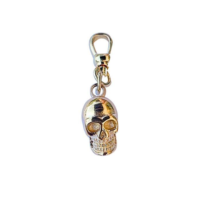 Become a trendsetter with our exclusive Skull Charm. Our 18KT gold-plated charm clip adds an extra touch of luxury while the brass and stainless steel materials ensure a durable and long-lasting accessory. With its unique design and sophisticated appeal, this charm is the perfect addition to any outfit. Make a statement and elevate your style with our Skull Charm. Charm Clip - 17mm (18KT, Brass) Skull Charm -17mm Stainless Steel, 18KT Gold Plated, Brass Comes with Charm Clip Attached Ships from Gold Jewelry With Metal Decoration, Gold Jewelry With Removable Charms For Everyday, Gold Metal Charms With Logo, Eyes Game, Akron Ohio, Western Jewelry, Drop Necklace, Chain Ring, Stainless Steel Material