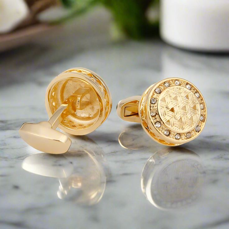 These circular gold cufflinks, adorned with striking blue stones, are the epitome of luxury and sophistication. The combination of gold and blue offers a timeless elegance, making these cufflinks a perfect accessory for special occasions. Dress Shirts: Crisp white dress shirt – provides a classic canvas that highlights the gold and blue contrast. Light blue dress shirt – complements the blue stones while adding a cohesive look. Pale yellow dress shirt with a subtle grid pattern – enhances the go Timeless Gold Cufflinks As Gift, Formal Round Jewelry With Screw Back, Timeless Round Cufflinks For Anniversary, Timeless Gold Cufflinks For Business, Luxury Screw Back Wedding Jewelry, Classic Metal Jewelry For Business, Rose Gold Cuff Jewelry For Formal Occasions, Timeless Anniversary Cufflinks, Gold Cuff Jewelry For Business