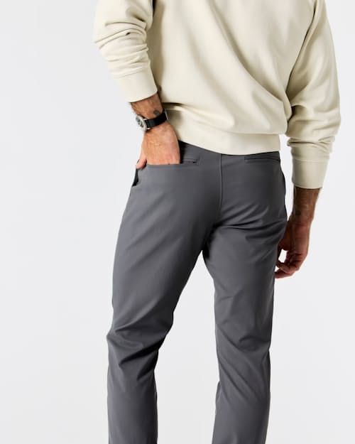 A tech pant in stealth mode Sporty Straight Leg Pants With Belt Loops, Sporty Straight Leg Pants With Functional Pockets, Gray 4-way Stretch Pants With Pockets, Urban Fitted Sports Pants, Urban Fitted Pants For Sports, Midweight Sports Bottoms With Hip Pockets, Sports Straight Hem Solid Pants, Functional Straight Leg 4-way Stretch Pants, Solid Color Sports Pants With Straight Hem