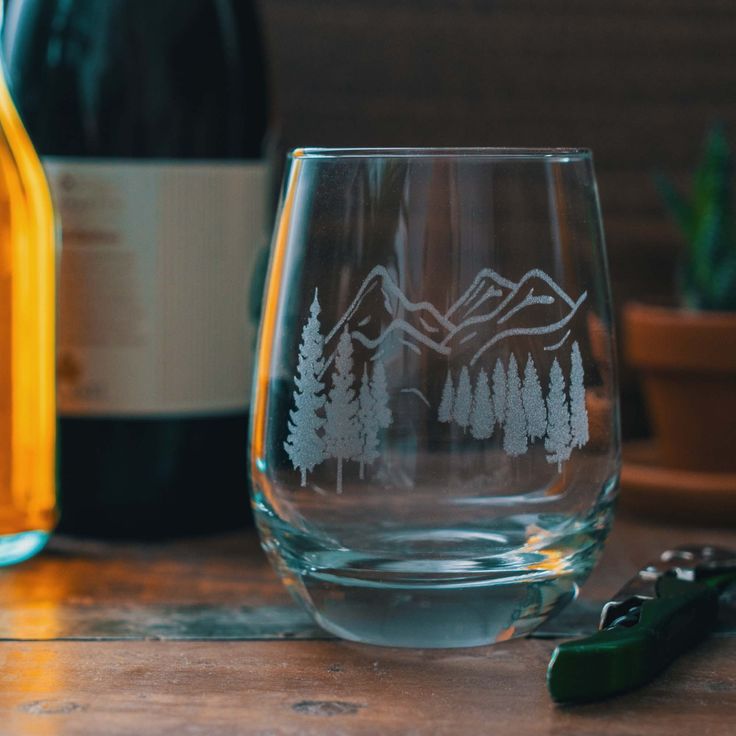 a wine glass sitting on top of a wooden table