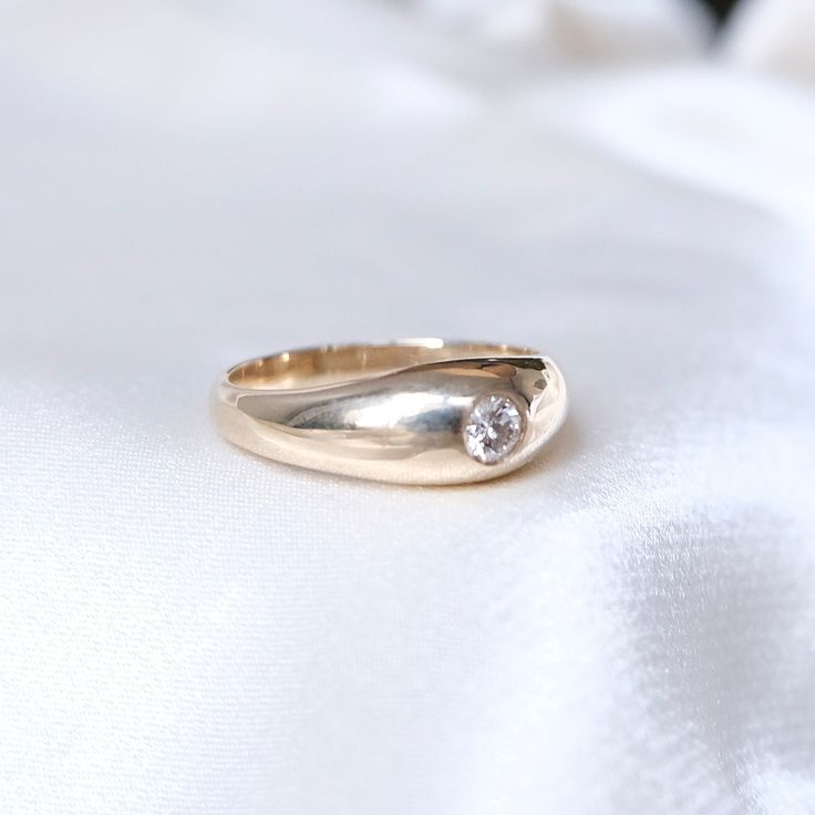 In this unique made-to-order ring, we've married the old world with the new. Designed by Hail The Maison and made by hand with our local New York jewelers, we breathe new life into this vintage design. Inspired by our trips to Spain and our admiration for the smooth and surreal works of Salvador Dali, in the Dali Diamond Dome Ring we wanted to create the perfect statement or index finger ring, with high shine and impact. A stunning flush set diamond sits perfectly mounted in a semi-dome setting Luxury Heirloom Dome Ring For Engagement, Wedding 14k Gold Signet Ring With Round Cut, Vintage Solitaire Signet Promise Ring, Timeless 14k Gold Engraved Ring With Rose Cut Diamonds, Heirloom 14k Gold Signet Ring With Rose Cut Diamonds, Timeless 14k Gold Wedding Ring, Timeless 14k Wedding Ring, Heirloom Style Open Diamond Ring, Vintage Single Diamond Jewelry With Round Band