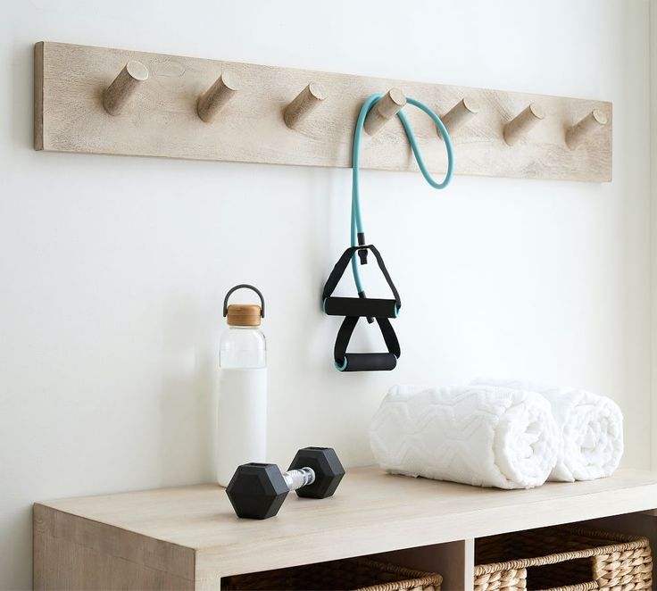 a towel rack with hooks on the wall