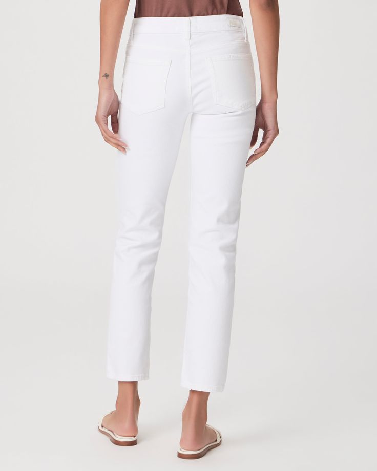 Meet your new favorite pair of white denim, finished with an ankle length inseam, vintage silver hardware, a white back patch and a destructed hem. This mid-rise straight leg is crafted from comfort stretch crisp white denim in the perfect weight that provides coverage and has a bit of stretch for the most comfortable fit. *Due to the unique nature of the distressing process, the destruction on the hem may vary by garment. White Rigid Denim Bottoms, White High Rise Rigid Denim Jeans, White Straight Leg Rigid Denim Bottoms, White Mid-rise Elastane Jeans, White Stretch Full-length Jeans, Back Patch, White Denim, Ankle Length, Straight Jeans