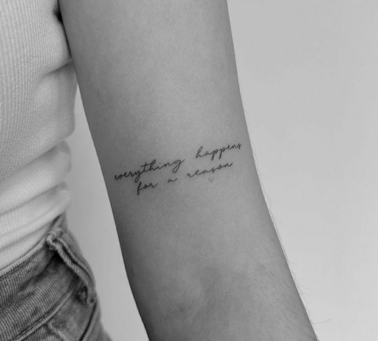 a woman with a tattoo on her arm saying something happens