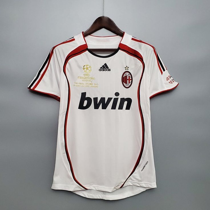 a soccer jersey hanging on a hanger