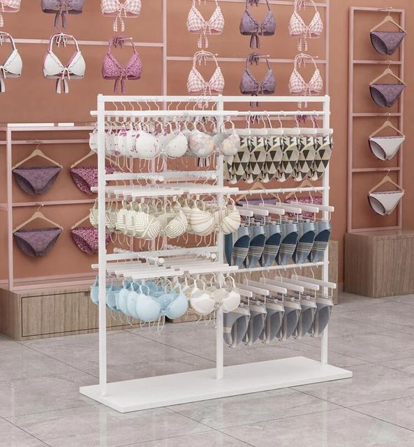 a display in a store filled with lots of bras hanging from the ceiling and on shelves