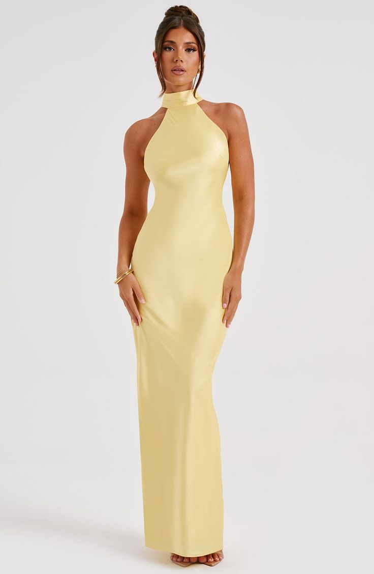 Here's to the nights you will remember because of the fits you won't forget. You will be unforgettable in Etta, our luxe maxi made from bias cut satin that skims beautifully over the body. The dress is completely backless with a high neck and an oversized tie neck detail. Elevate any look with Etta, platform heels and a sleek knot. 



Colour: Lemon.

Luxury bias cut satin.

High neckline.

Backless detail.

Skims over the figure.

Flares gently at the hem.

Maxi length.

Model is an XS and is w Elegant Dresses Yellow, Open Back Wedding Guest Dress, Year 12 Formal Dresses Australia, Yellow Long Dresses, Satin Dress Backless, Bridesmaid Dresses Yellow, Lemon Bridesmaid Dresses, High Neck Dress Formal, Yellow Cocktail Dress