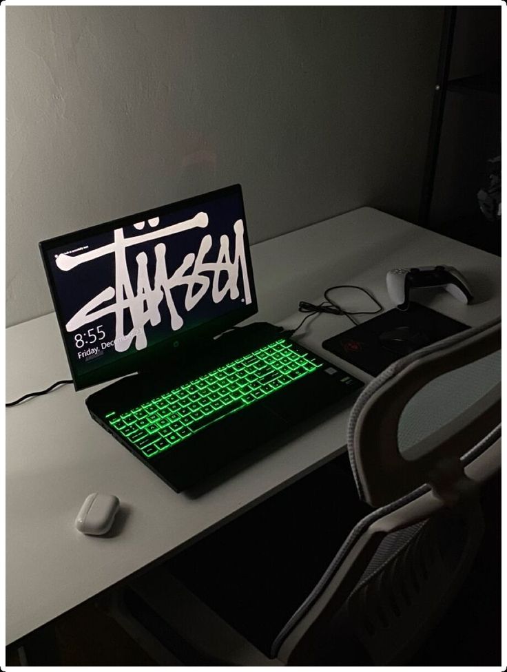 a laptop computer sitting on top of a white desk