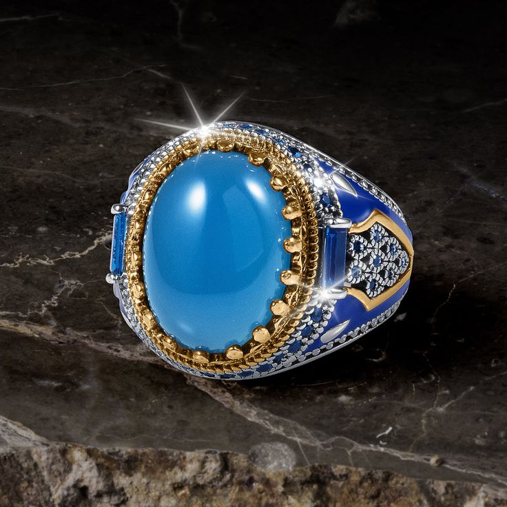 This suave ring with added layers of luxury is one you will want to wear always. A sterling silver mount with a two tone finish houses over 9 carats of oval blue Agate gemstone. The shoulders and main stone are adorned with signature Diamondeau®, flawless simulated diamond. Agate is a stone of strength and was used on the breastplates of armor by warriors. Rise victorious with this standout ring that cannot be ignored. Luxury Agate Men's Ring, Gold Watch Men, Latest Jewellery, Men's Necklace, Blue Agate, Men's Ring, Mens Jewelry Bracelet, Love Necklace, Agate Gemstone