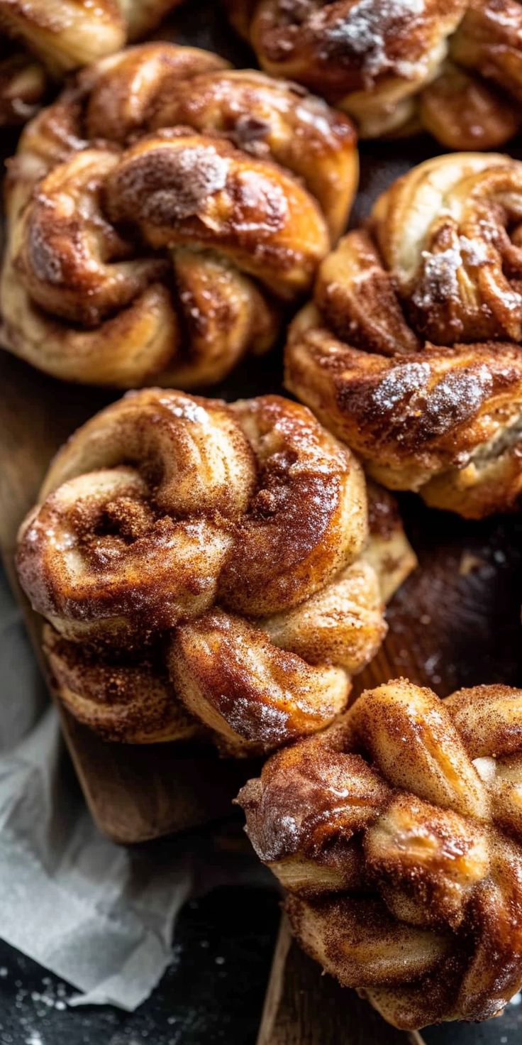 cinnamon buns are piled on top of each other