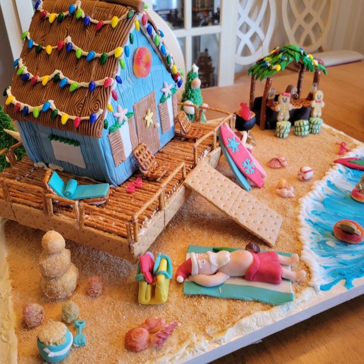 a gingerbread house is decorated with beach decorations