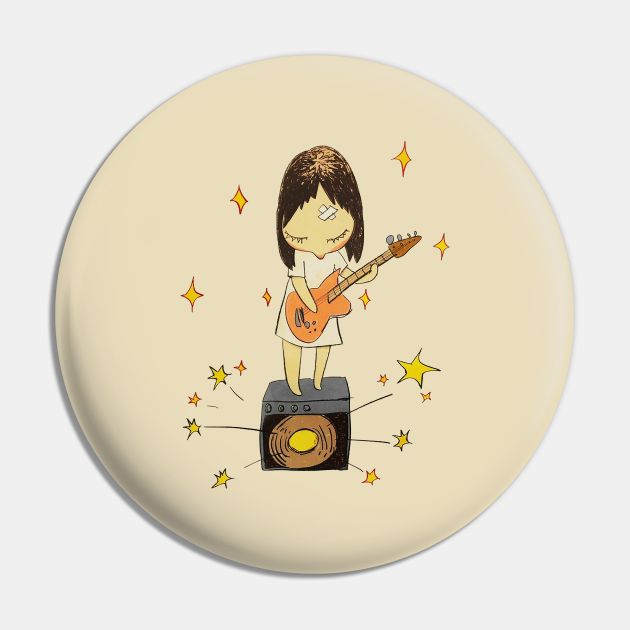 a button with a drawing of a person playing the guitar on top of a speaker