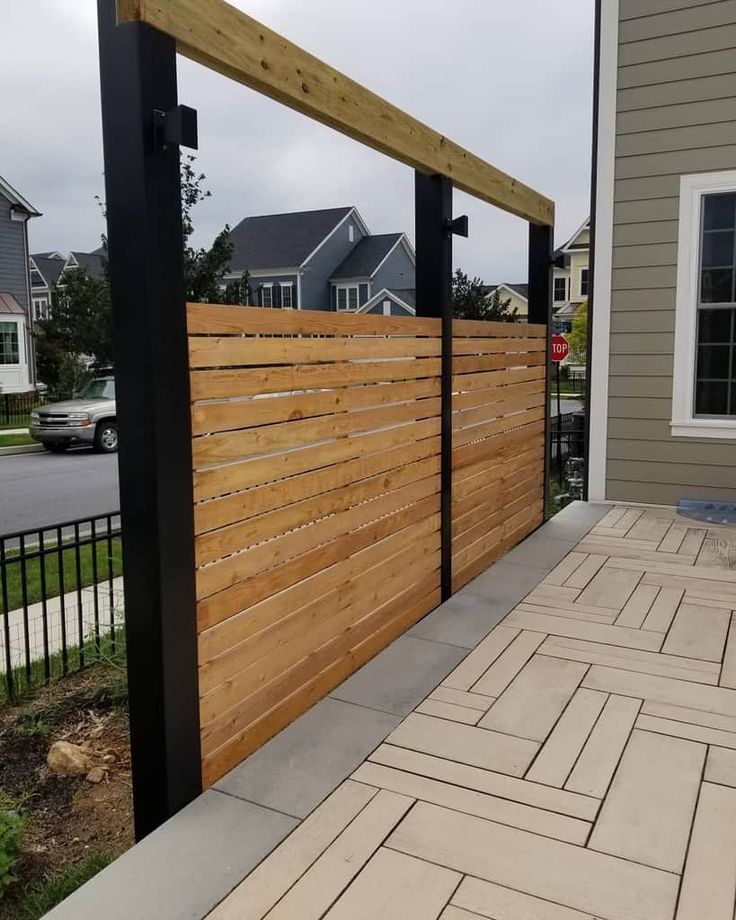 a wooden fence on the side of a house