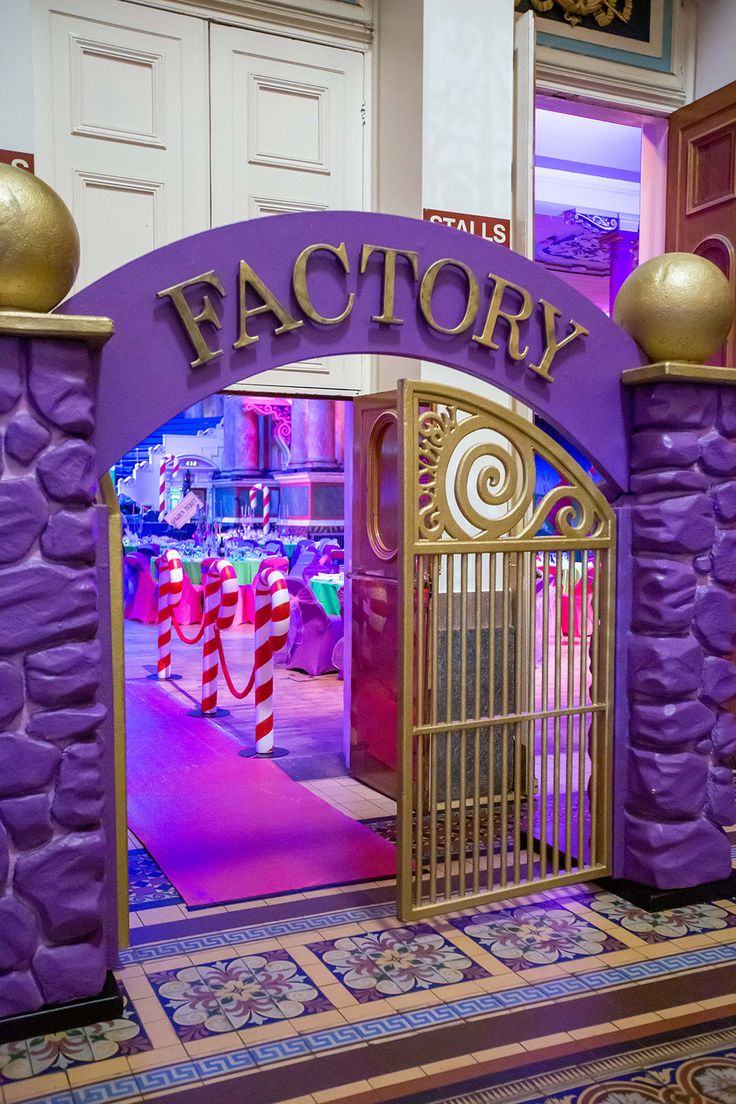 the entrance to factory is decorated in purple and gold