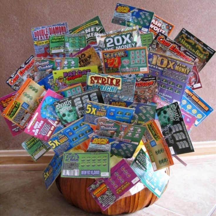 a wooden basket filled with lots of different types of candy bar wrapper stickers