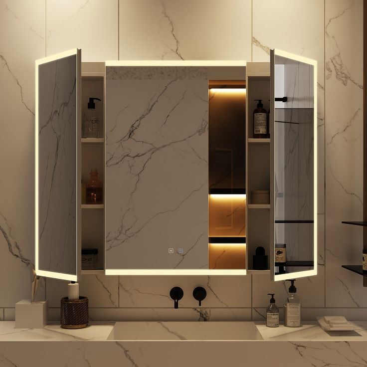 a bathroom with marble walls and flooring, lighted by recessed lighting above the sink