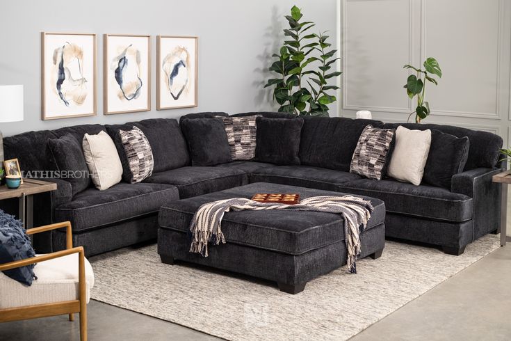 a living room with a sectional couch and ottoman