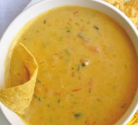 a bowl of soup with tortilla chips on the side