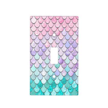 a light switch cover with pink and blue mermaid scales