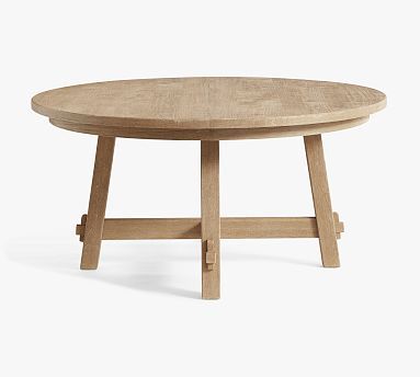 a wooden table with two legs and a round top, sitting on a white surface