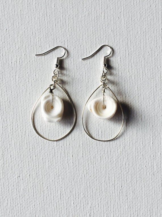 Hawaii Puka Shell Silver Hoop Earrings White Dangle Earrings With Fish Hook, White Drop Earrings With Fish Hooks, Nickel Free Adjustable Shell-shaped Earrings, Teardrop Hoop Earrings With Ear Wire For Beach, Nickel-free Adjustable Shell-shaped Earrings, Minimalist Beach Jewelry With Ear Wire, Adjustable Silver Shell-shaped Earrings, Beach Hoop Earrings Wire Wrapped, Beach Hoop Earrings With Wire Wrapping