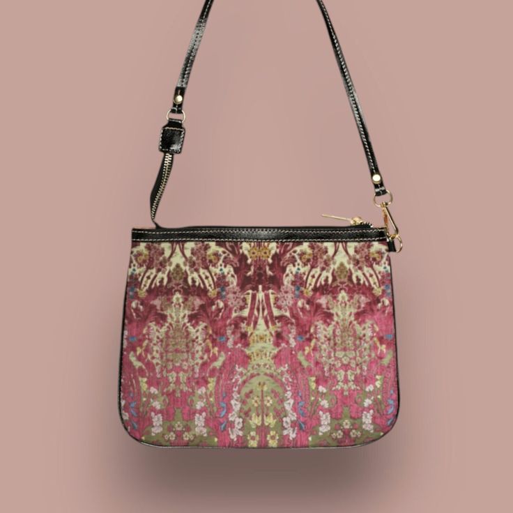 This unique and vibrant shoulder bag adds a chic touch to any outfit. Its compact size (10"w x 8"h) and lightweight construction makes it the perfect accessory for carrying around your essentials in style. Our one of a kind purse features a late nineteenth- century archival Italian art nouveau damask and velvet wallpaper design in rose and burgundy tones. This gorgeous design is printed onto high-grade vegan leather by our top-rated production partner just for you. Pair this item with our coordinating products: Vegan wallet: https://thecheekyshedonist.etsy.com/listing/1680599092 Vacuum-insulated copper water bottle: https://thecheekyshedonist.etsy.com/listing/1348690910 .: 100% high-grade vegan leather exterior .: Polyester lining + 20-inch black strap .: Two open pockets inside .: Gold-to Luxury Zipper Pouch Shoulder Bag For Travel, Luxury Travel Shoulder Bag With Zipper Pouch, Trendy On-the-go Clutch Shoulder Bag, Pink Evening Bag With Zipper Closure, Detachable Strap Crossbody Baguette Bag, Crossbody Baguette Bag With Detachable Strap, Clutch Shoulder Bag With Zipper For Daily Use, Everyday Clutch Shoulder Bag With Zipper, Trendy Shoulder Bag With Zipper Pouch